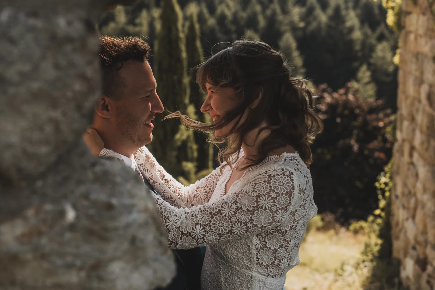 Couple in a tender moment in the garden — destination wedding in the Ardèche