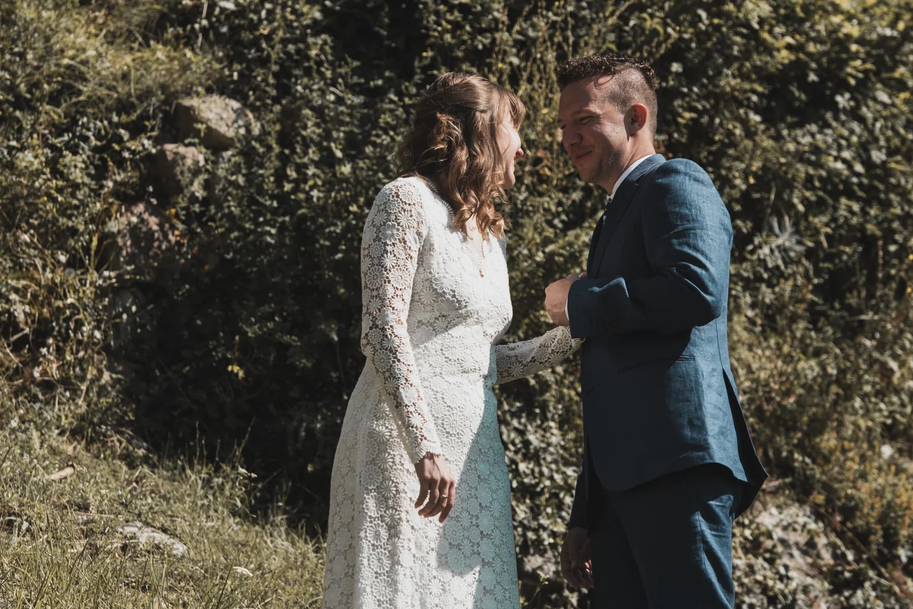 Bride in the château garden — spontaneous destination wedding portrait