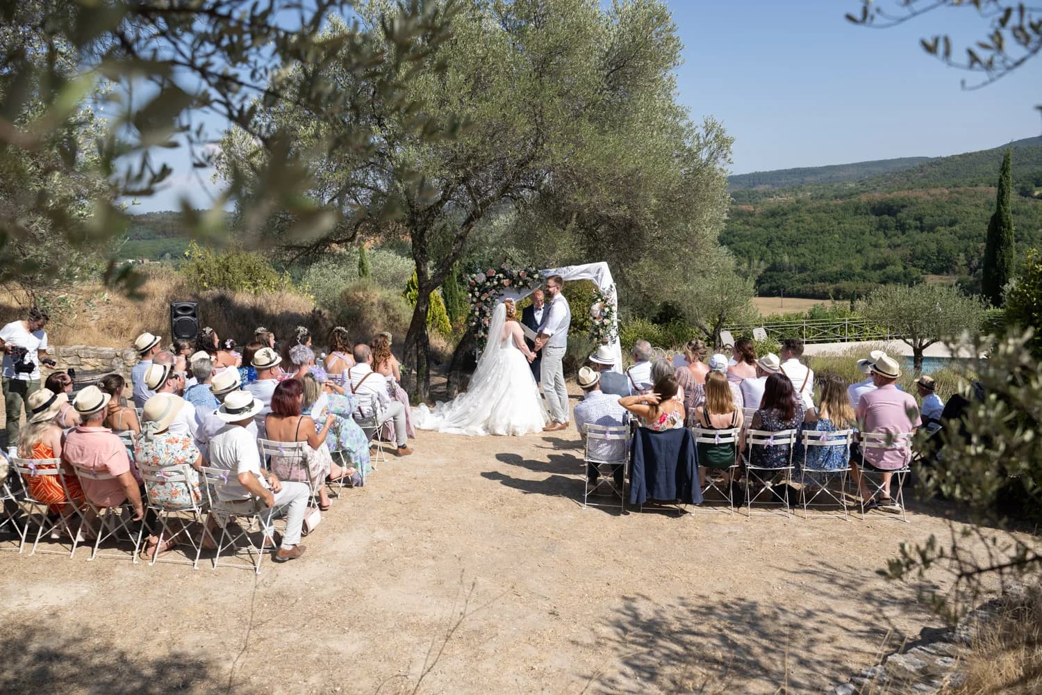 Destination wedding photographer Gard, South of France — outdoor ceremony beneath olive trees at Domaine du Clos d'Hullias